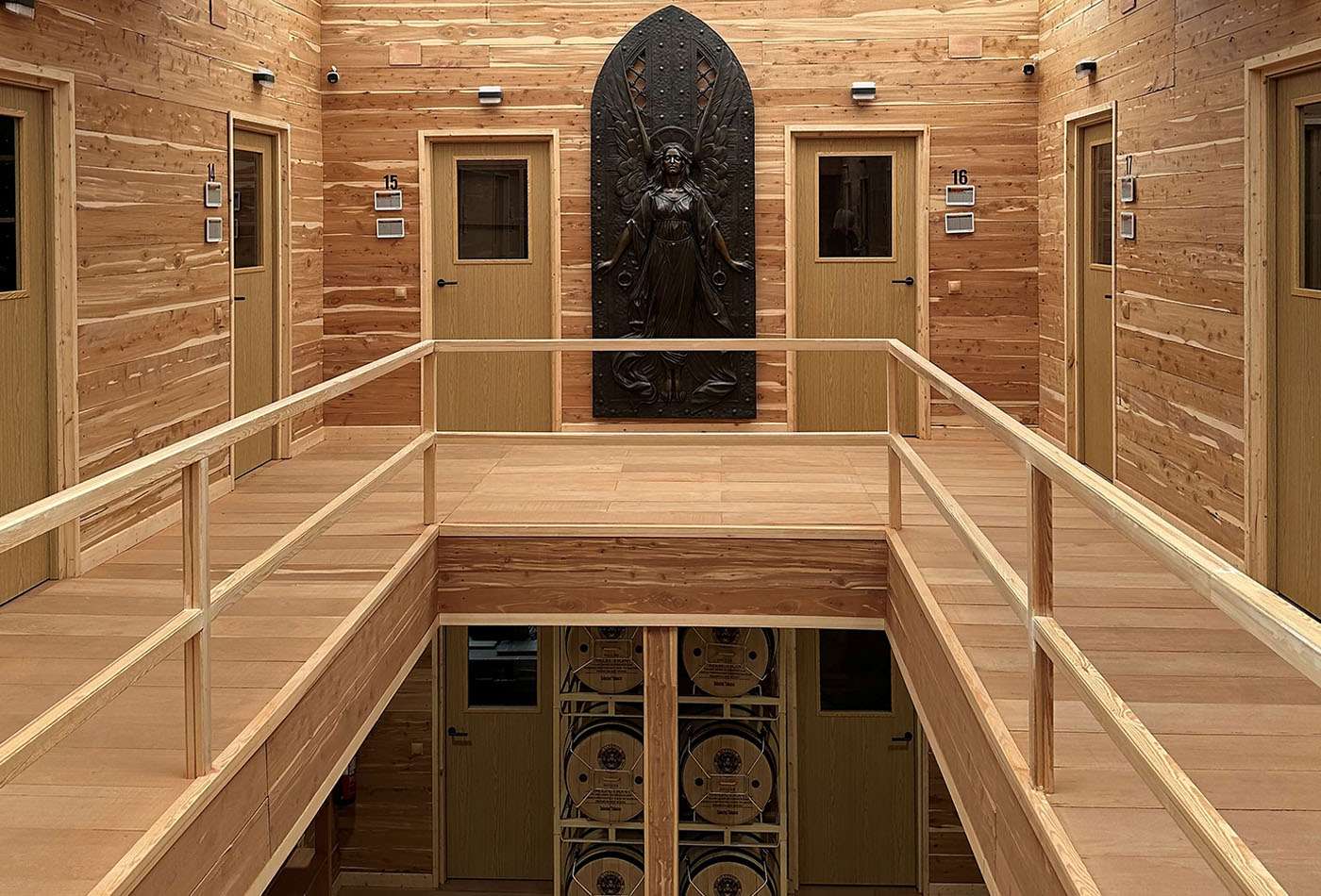 Wood-lined walkway between aging rooms at Selected Tobacco's Madrid headquarters